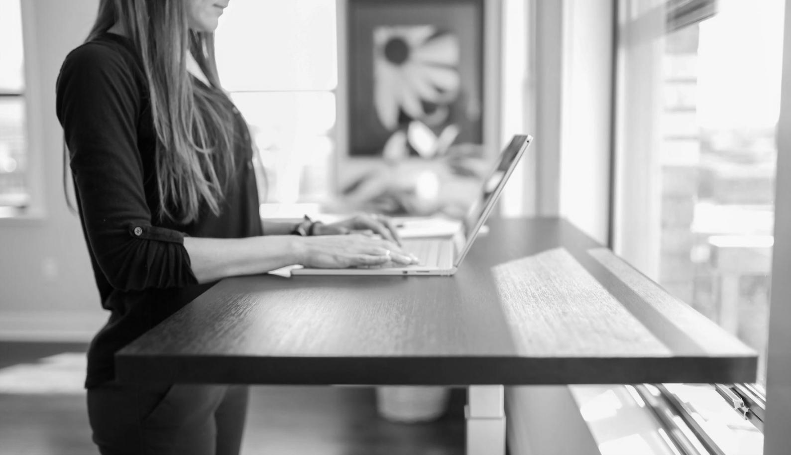 Students working together on budget planning exercises during an evening class session